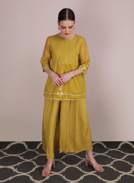 Ochre Cherry Blossom peplum top with culottes, model standing front view