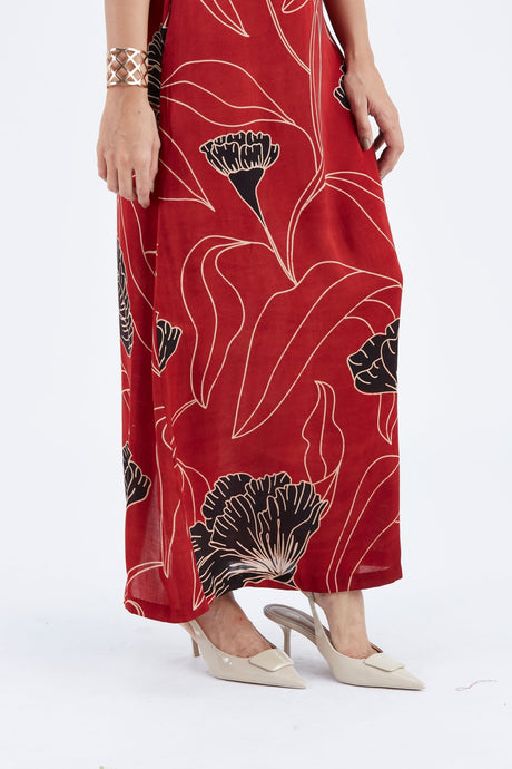 Close-up of the Elara Dress skirt with black flower and cream leaf line print