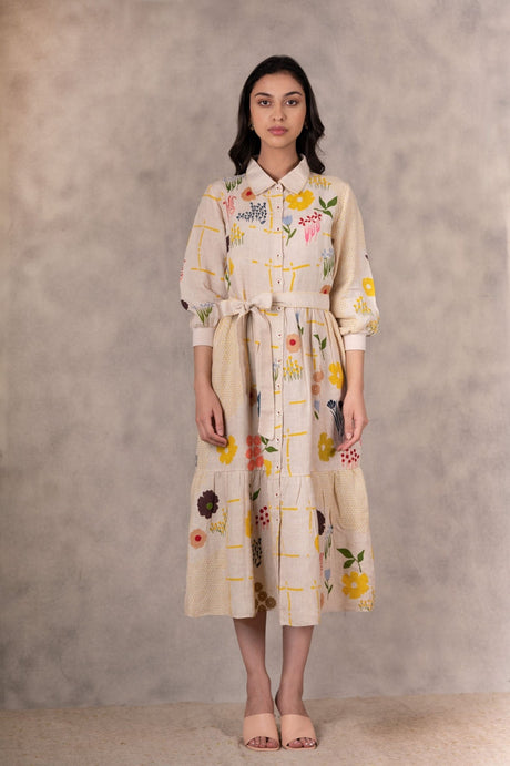 Floral Print Tiered Dress in linen from ARCVSH by Pallavi Singh in ivory with shirt collar and tie belt, front view