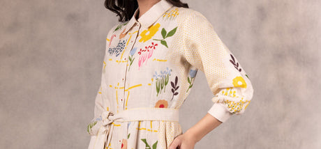 Cropped close-up of the floral tiered dress collar, printed flowers and balloon sleeve