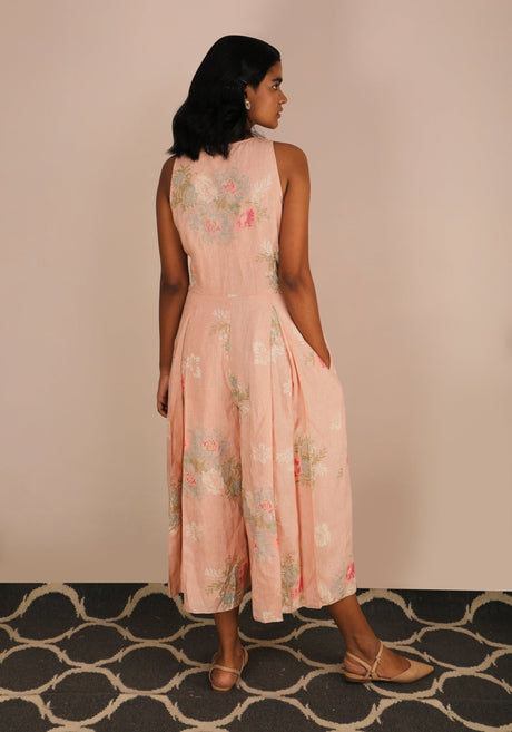 Florence Rose Print Jumpsuit back view, model with hands in pockets