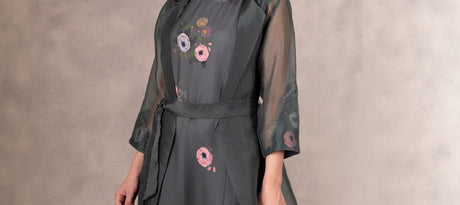 Cropped close-up of the Eden dress bodice and sheer jacket front