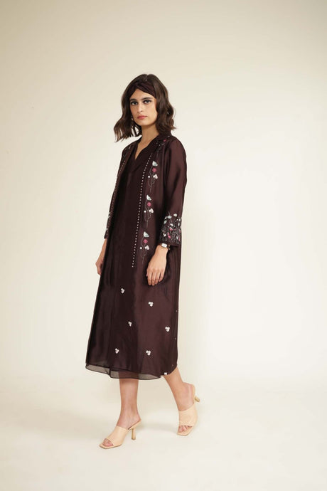 Model walking in the grape embroidered jacket and midi dress, three-quarter view