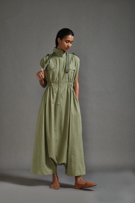 Green Safari Sphara Jumpsuit by MATI, sage sleeveless high neck jumpsuit with chest pockets, front view
