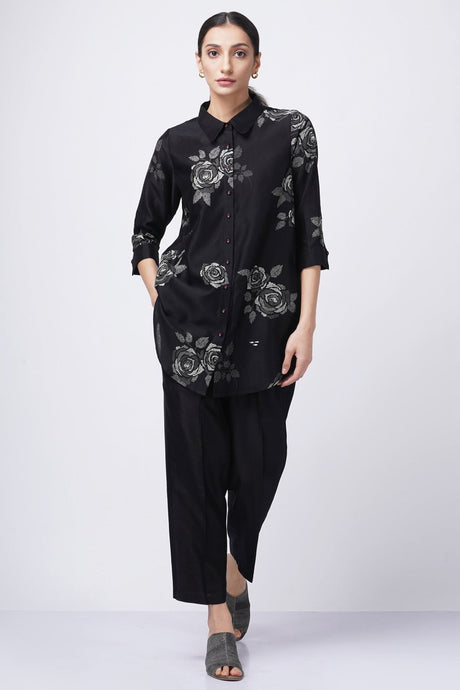 Grey shade rose printed shirt with solid pant from ARCVSH by Pallavi Singh, black shirt with grey roses, front view