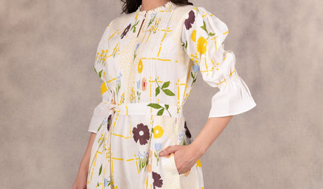 Cropped close-up of the floral jumpsuit bell sleeve and pocket