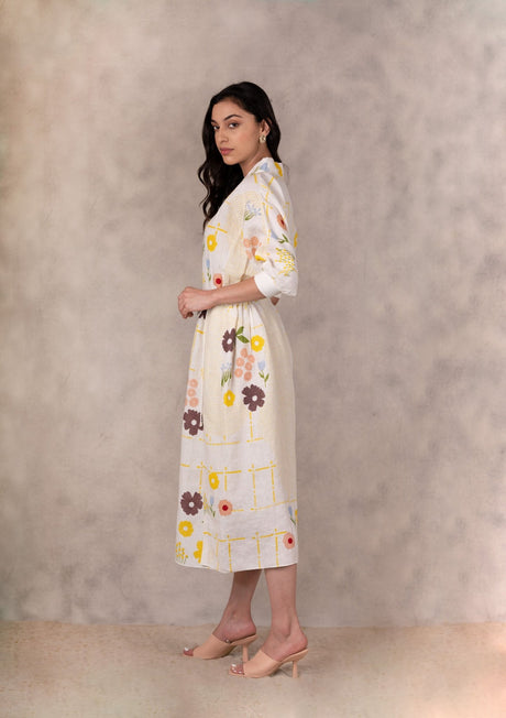 Handmade floral linen dress side profile view with the tie at the waist