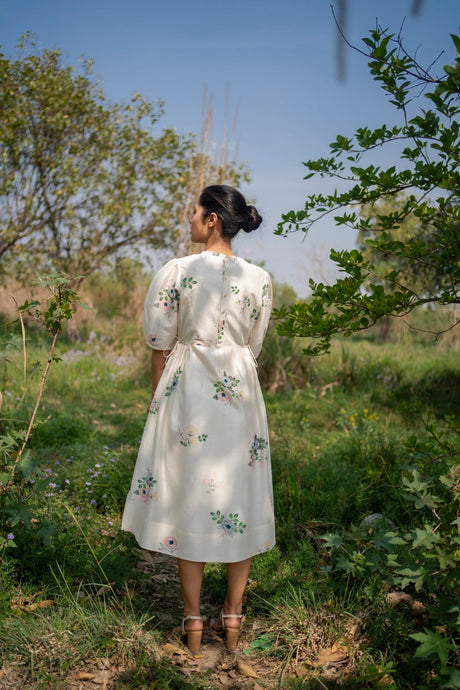 Ivory Drawstring dress back view with drawstring waist and puff sleeves, model wearing it