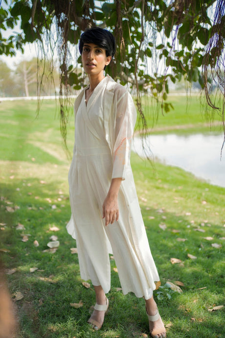 Ivory Jacket and Jumpsuit with wide legs, model standing, front view