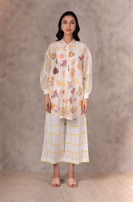Ivory yellow checkered linen pants with wide cropped legs, full length front view
