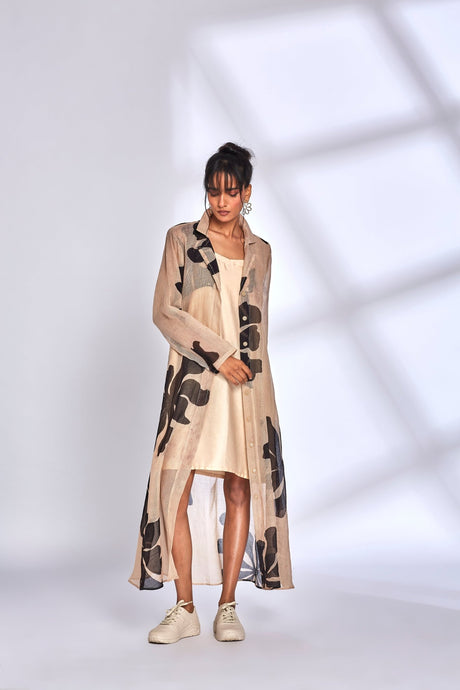Model wearing the Lana Dress open with a high low hem and sneakers, front view