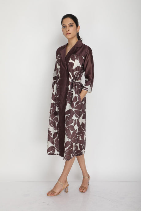 Model walking in the grape Lotus print dress with side pockets, three-quarter view