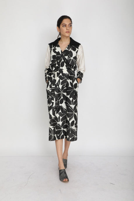 Lotus print dress from ARCVSH by Pallavi Singh in black and ivory with black collar and tie belt, front view