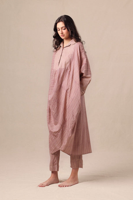 Model wearing the Mauve Striped Shirt Cowl Tunic & SE Pants set, three quarter view of the draped hem