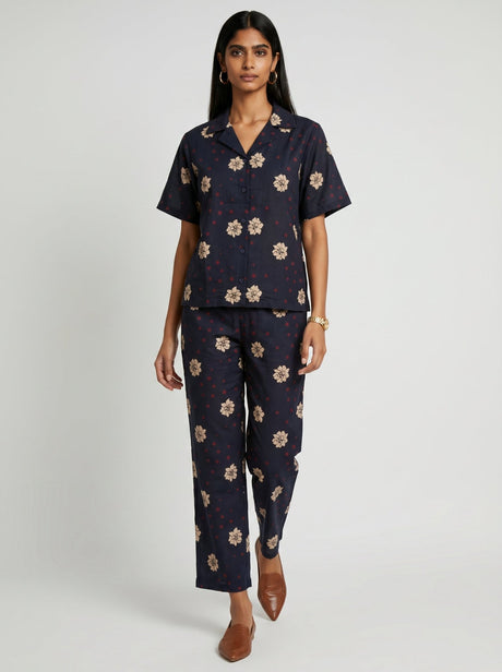 May Black Modal Co-ord set by Hasttvam, dark camp collar shirt and pants with cream floral motifs, front view