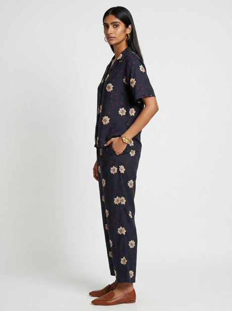 May Black Modal Co-ord set with hand in pocket and brown loafers, three quarter view