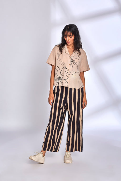 Meadow Co-ord Set by Hasttvam, beige boxy shirt with black line florals and black striped wide pants, front view