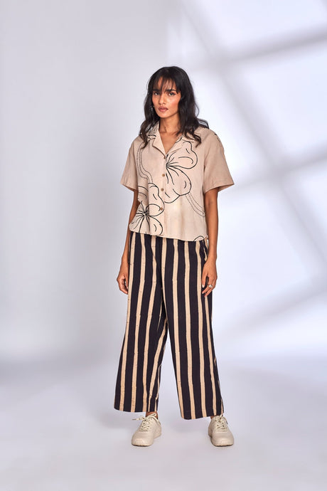 Model wearing the Meadow Co-ord Set with short sleeves and white sneakers, front view