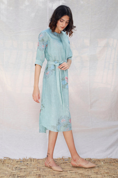 Model walking in the Mint Front Pleat Slip Linen Dress, front view
