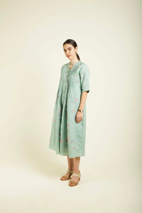 Mint linen printed dress three quarter view showing the band collar and elbow sleeves