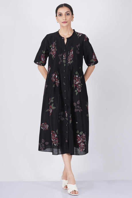 Multicolor rose printed pleated dress from ARCVSH by Pallavi Singh, black midi dress with roses and short sleeves, front view