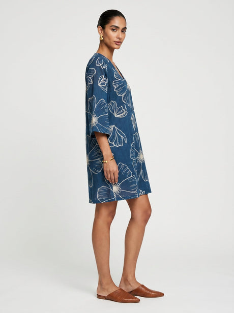 Side view of the Noa Blue Cotton Dress showing the relaxed fit and wide sleeve