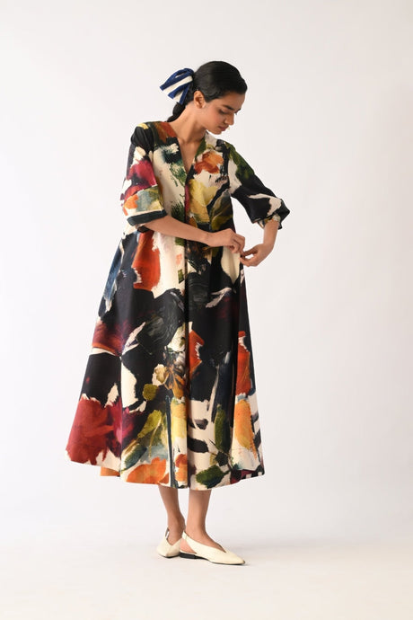Noir Mayflower Dress three quarter view adjusting the sleeve cuff