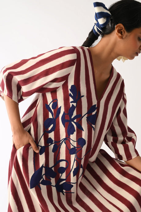Close-up of the Revolt Bric Mayflower Applique Dress V-neck and navy applique