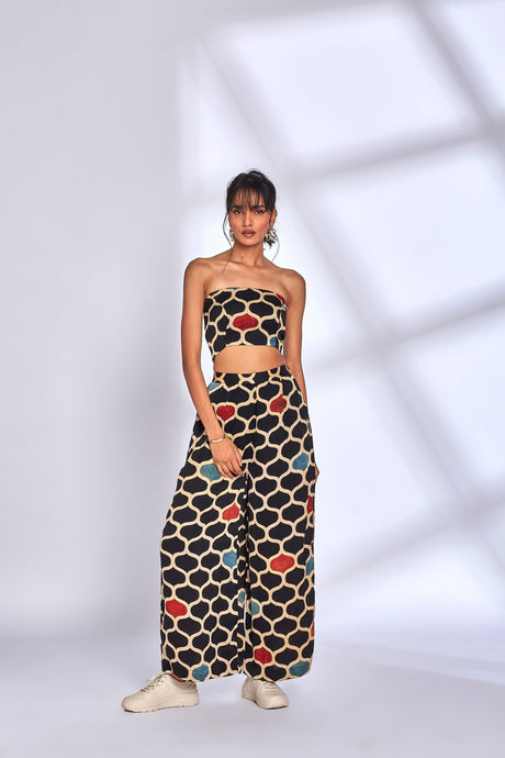 Model wearing the Rosetta Co-ord Set with red and blue accent print, full length front view