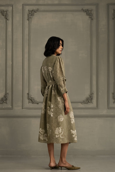 Sage green gauze linen dress with white floral discharge print, three quarter back view