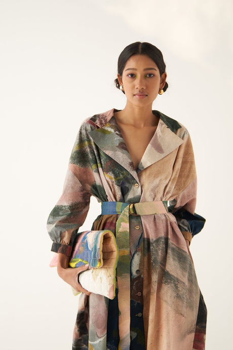 Close-up of the Wallflower Trench Set collar and belt with a printed clutch
