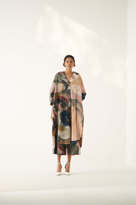 Wallflower Trench Set by Ofrida, blush pink and green abstract print long trench, model front view