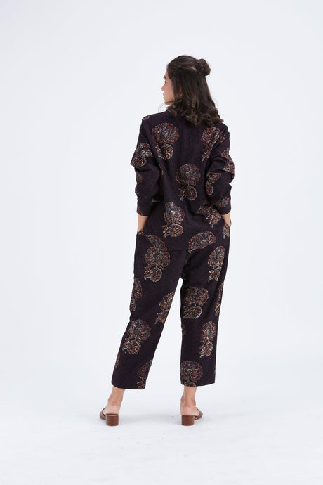 Back view of the Yuna Black co-ord set with relaxed shirt and cropped pants