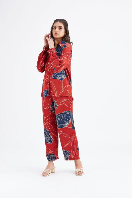 Model wearing the red Yuna co-ord set with collar and long sleeves, front view