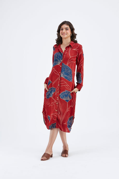Model wearing the red Zae dress with hands in pockets, front view