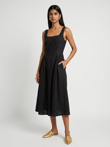 Zoe Sleeveless Black Chanderi Dress by Hasttvam, black square neck midi with pleated skirt and pockets, front view